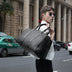 Spot  neutral travel bag, business portable big bag, solid color single shoulder hand-woven bag